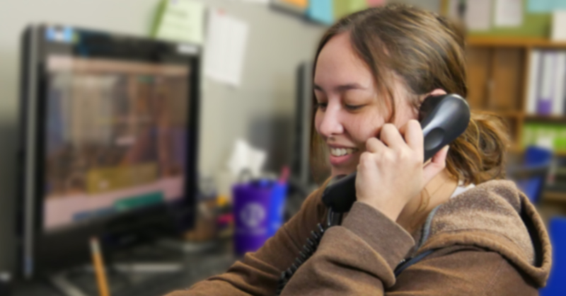 Photo of a Teen Lifeline teen peer counselor helping a caller on the hotline.