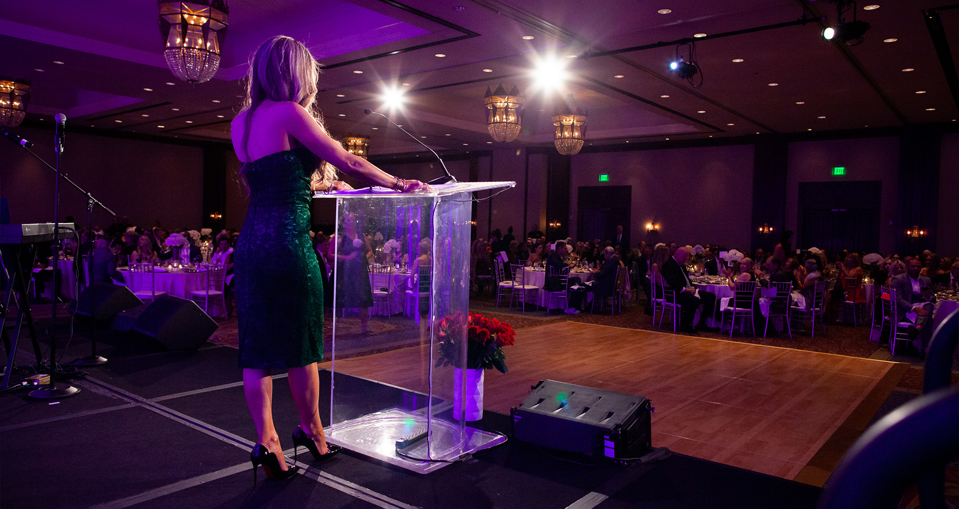 Photo of Event Chair Lana Breen speaking on stage at the 2022 Connections of Hope Gala.
