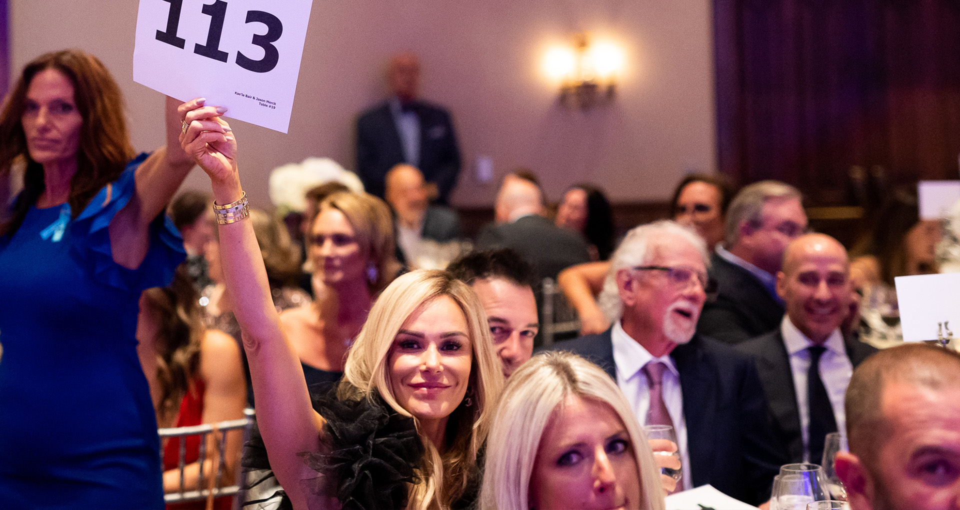 Photo of a bidder at the 2022 Connections of Hope Gala.