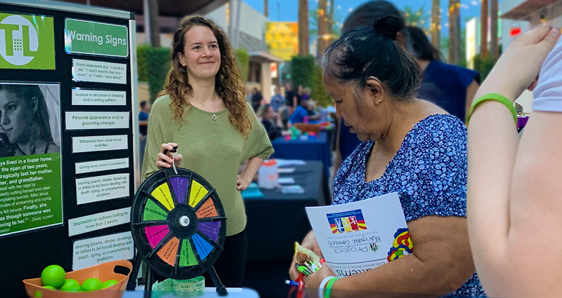 Prevention Specialist Sarah Schenk educating Arizonans about teen mental health and local resources at Teen Lifeline's 2022 Community Rally for Teen Suicide Prevention Awareness Month.