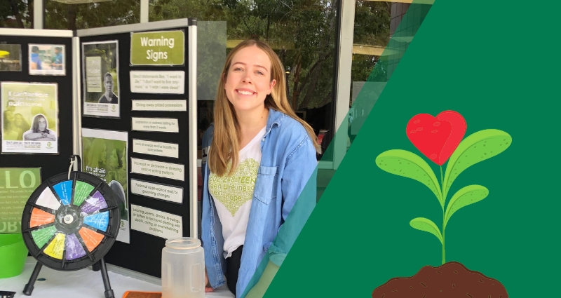 Photo of a Teen Lifeline resource booth at a school outreach event. To the right of the photo is a graphic of a plant growing from rich soil. The flower of the plant is a heart.